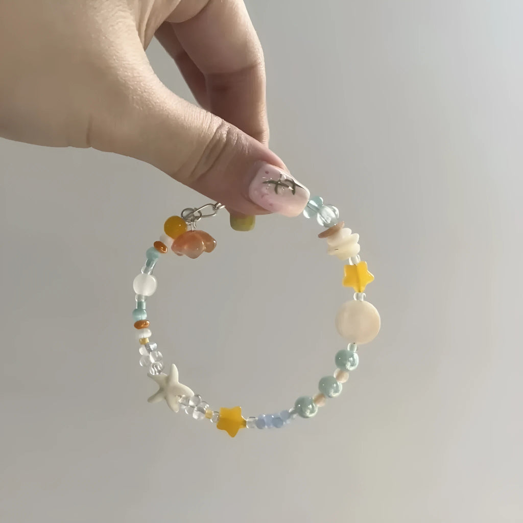 Orange mixed material diamond-shaped women's bracelet with round design elements