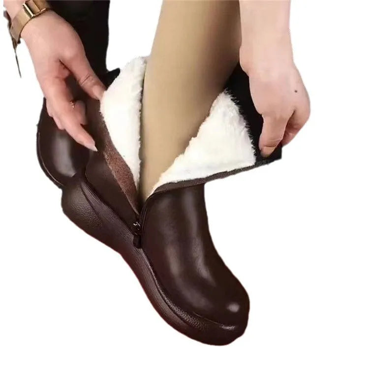 Retro British style flat boots with cowhide upper, side zipper, and metal decorative accents on a low tube silhouette.