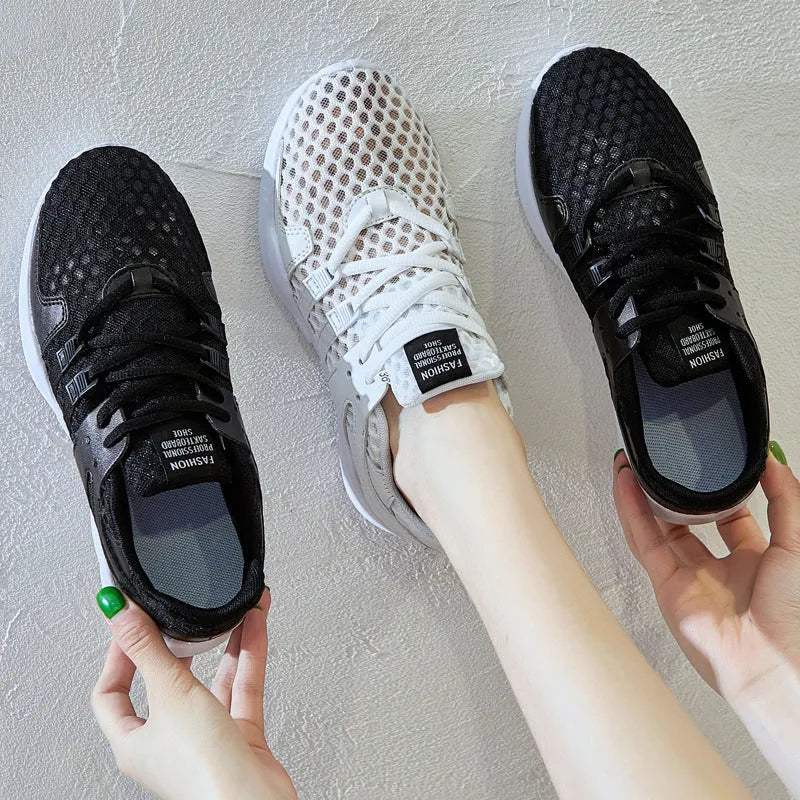 Breathable hollow mesh sneakers in black and white colours with round toe design