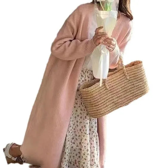 Women's loose-fit mid-length knitted cardigan in grey, showing V-neck and long sleeves.