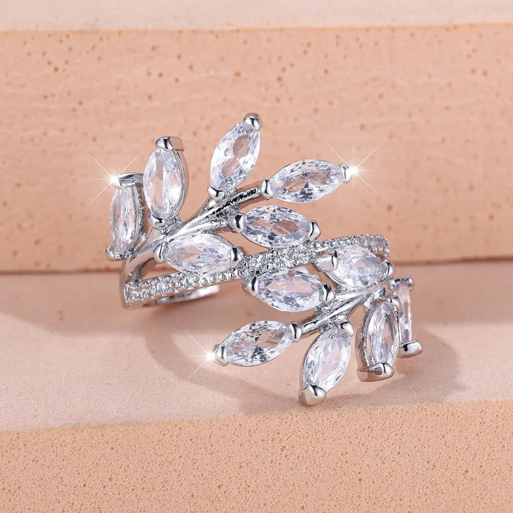 Adjustable horse eye design leaf ring in copper with zircon crystals, shown in a rose gold finish