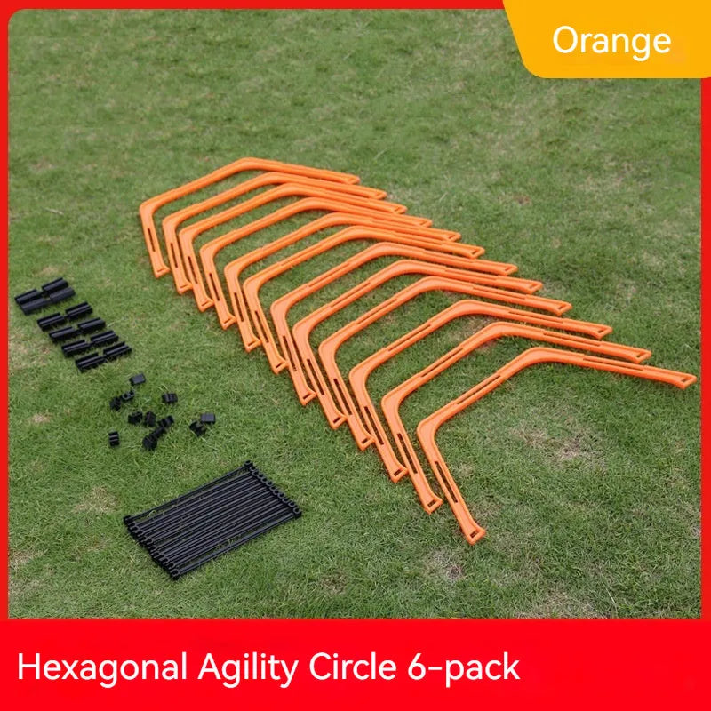 Set of six foldable yellow, green, and orange hexagon agility training rings on grass.