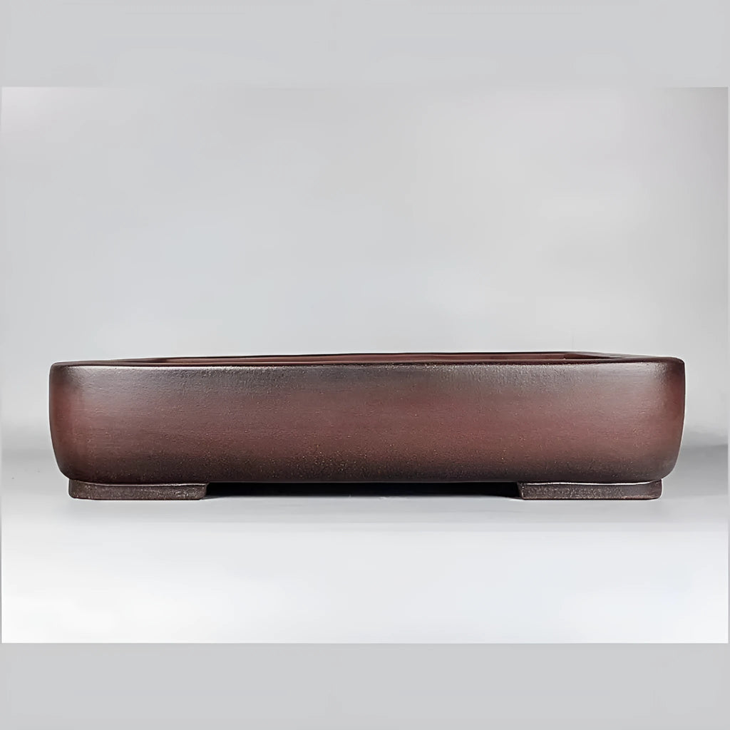 Handmade rectangular antique-style purple clay flower pot showing natural ceramic material