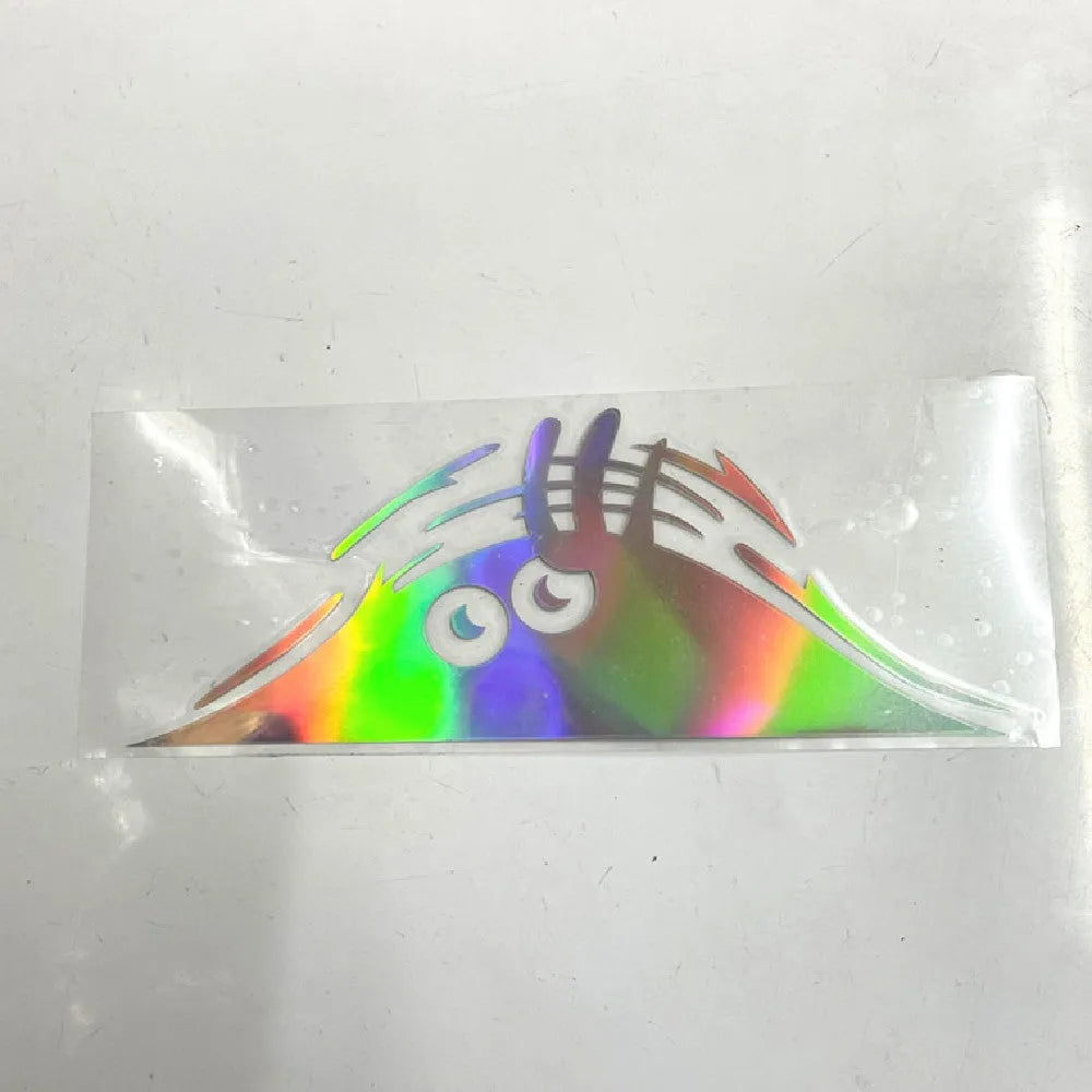 Large 19cm by 7cm self-adhesive body sticker showing four face design options on skin