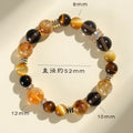Close-up of a natural yellow artificial crystal string bead bracelet with 10mm tower-shaped beads.