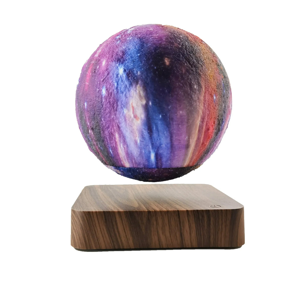Magnetic levitation galaxy moon lamp floating above walnut-coloured circular base with colourful star details