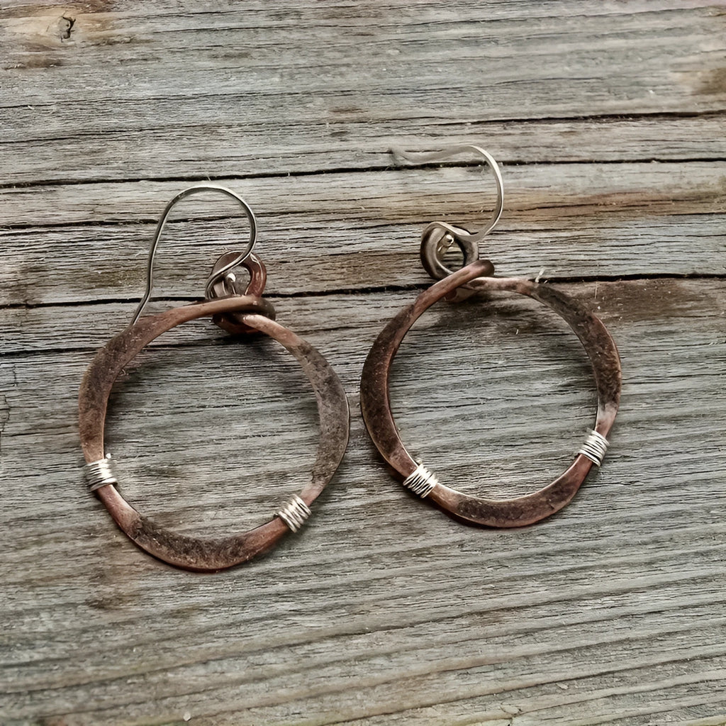 Retro hollow round bohemian earrings with bronze finish cable trim on female ear