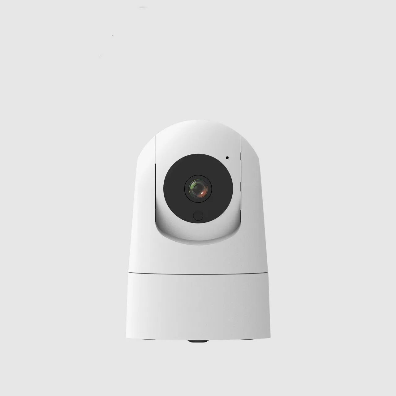 White square indoor security camera with lens and status light on front, shown next to its power adapter.