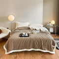 Polyester thermal flannel blanket in tea green colour, shown on a bed, size 180x200cm.