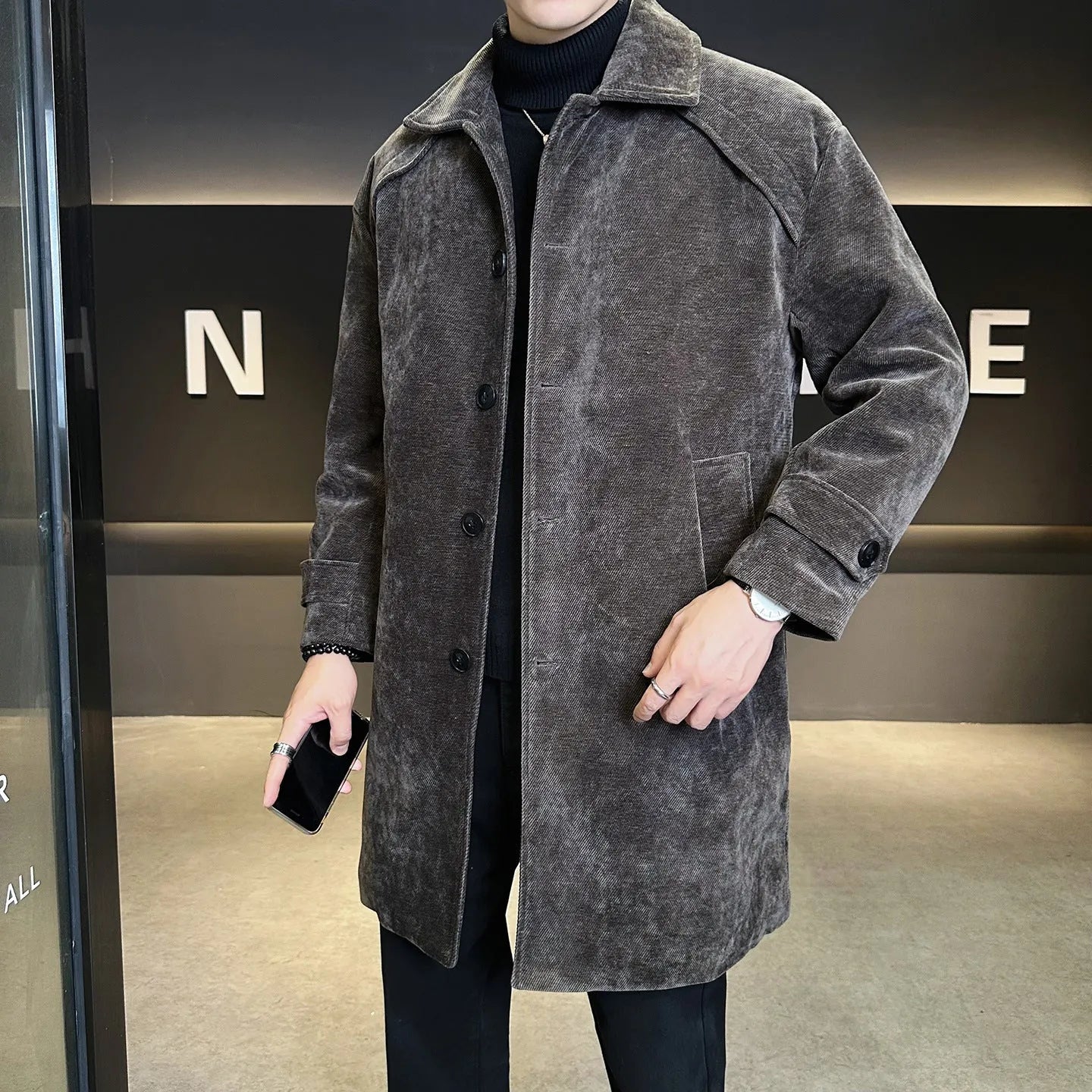 Long brown cotton wool blend jacket with thickened windproof construction, regular fit, and polyester lining, shown front view.