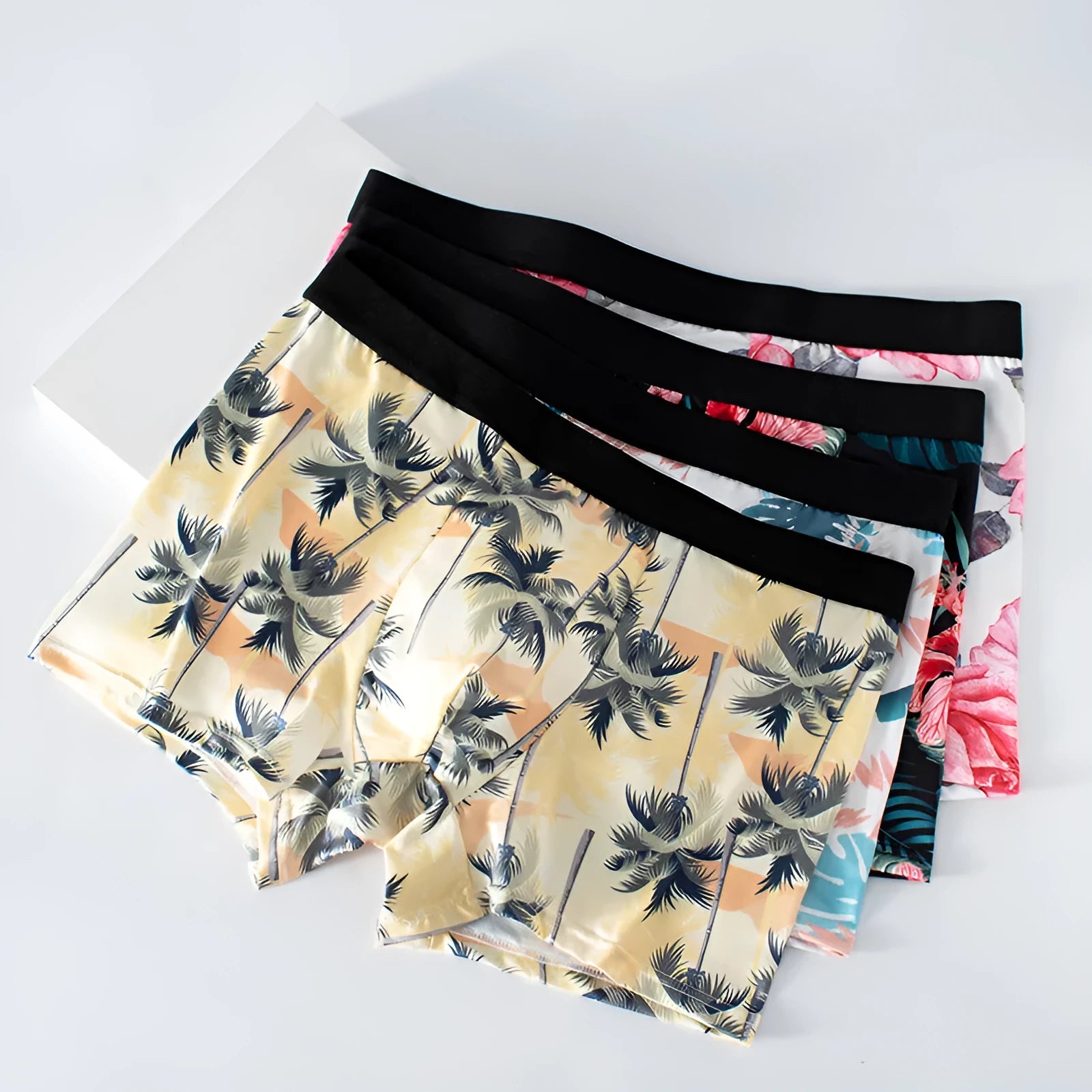 Men's ice silk polyester boxer shorts with printed pattern showing mid waist design