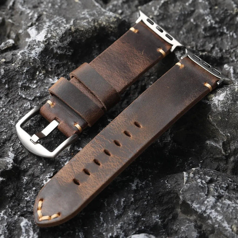 Brown handmade top layer cowhide watch strap with stainless steel buckle on a watch