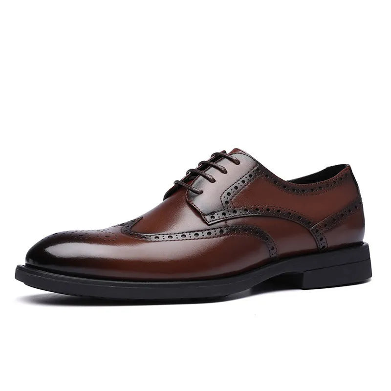 Men's black and brown brogue leather shoes for business style on a plain background.