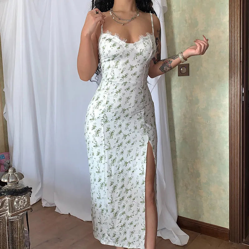 Blue lace flowers print long dress on a mannequin, showing side slit and suspender straps.