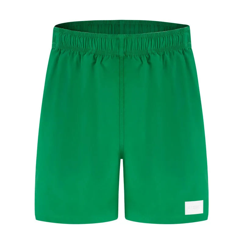Men's quick-drying nylon sports shorts in solid colours with straight leg opening.