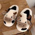 White cow pattern slippers with faux fur upper and textured non-slip soles