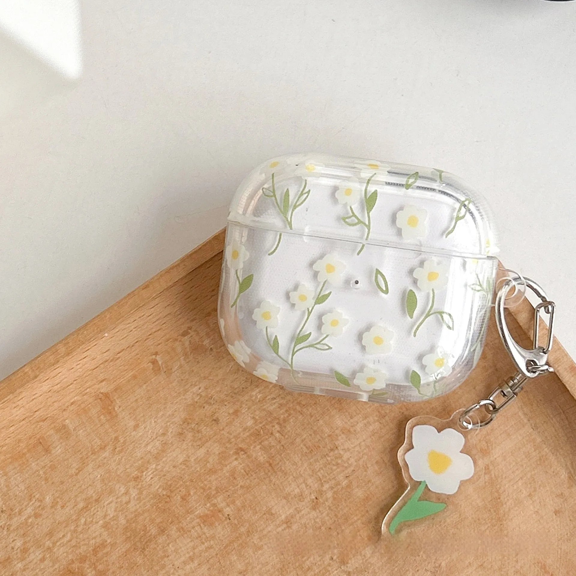 White floral patterned transparent TPU protective cover for Apple AirPods showing compatibility with multiple models