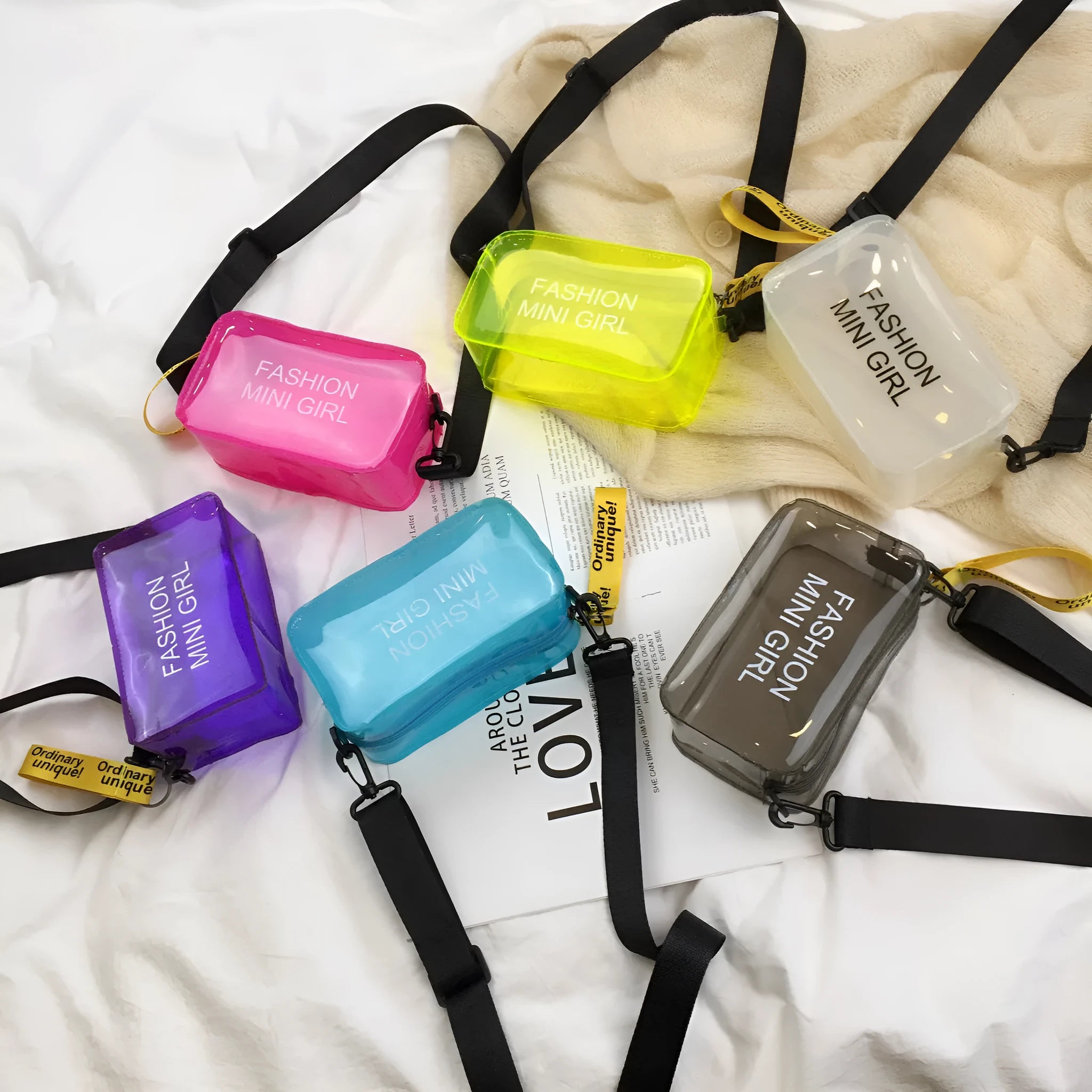 Transparent square jelly women's shoulder bag with an adjustable long strap, shown in multiple colours.