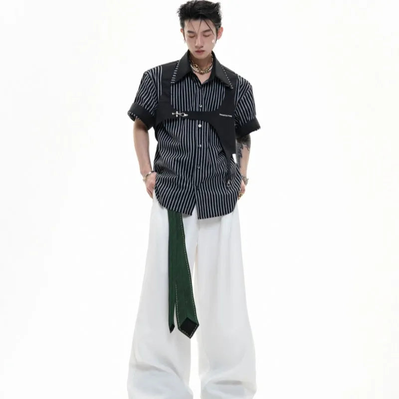 Man modelling a black and white striped cotton shirt with a double collar design and short sleeves.