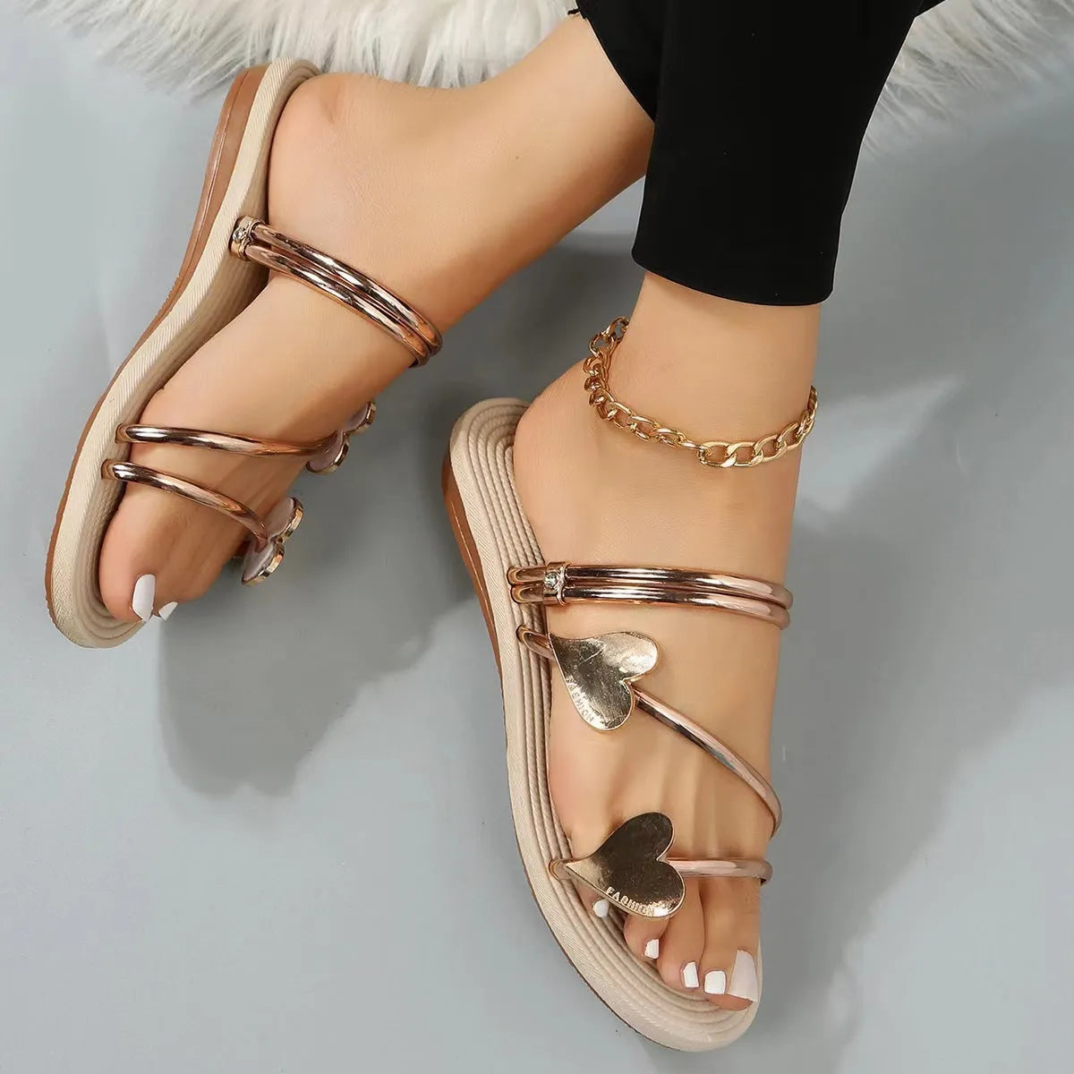Heart shape flat slippers for women in gold colour with foam sole