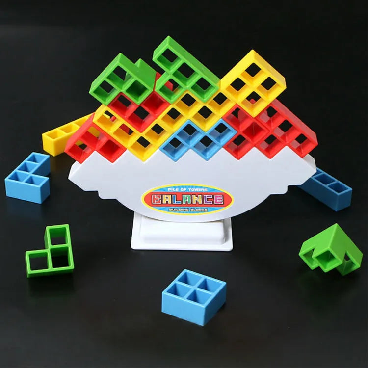 Plastic balance stacking game with 16 colourful building blocks on chassis