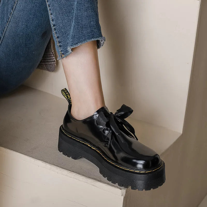 Women's thick-soled leather shoes in black with ribbon and cross strap details on superfine fibre upper