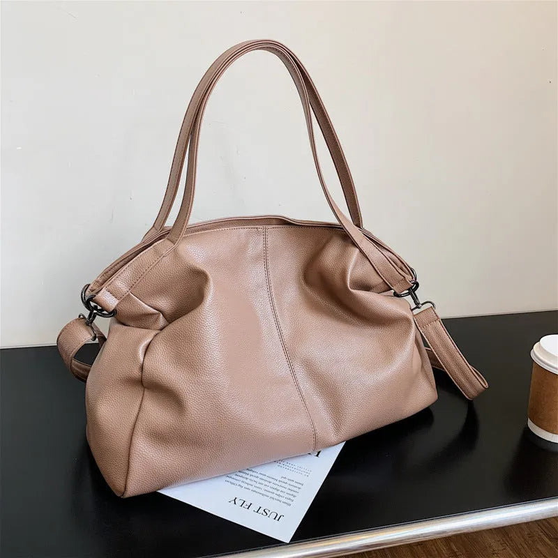Large soft surface PU messenger bag in a horizontal square tote style with a shoulder strap.