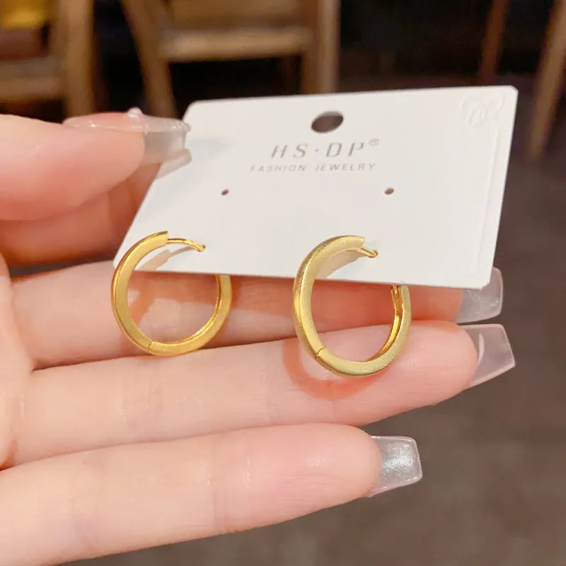 Geometric round eyelet ear clip jewellery in gold colour with real gold plating on copper material