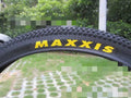 Ultralight puncture-resistant mountain bike tyre showing tread pattern, available in multiple wheel sizes.