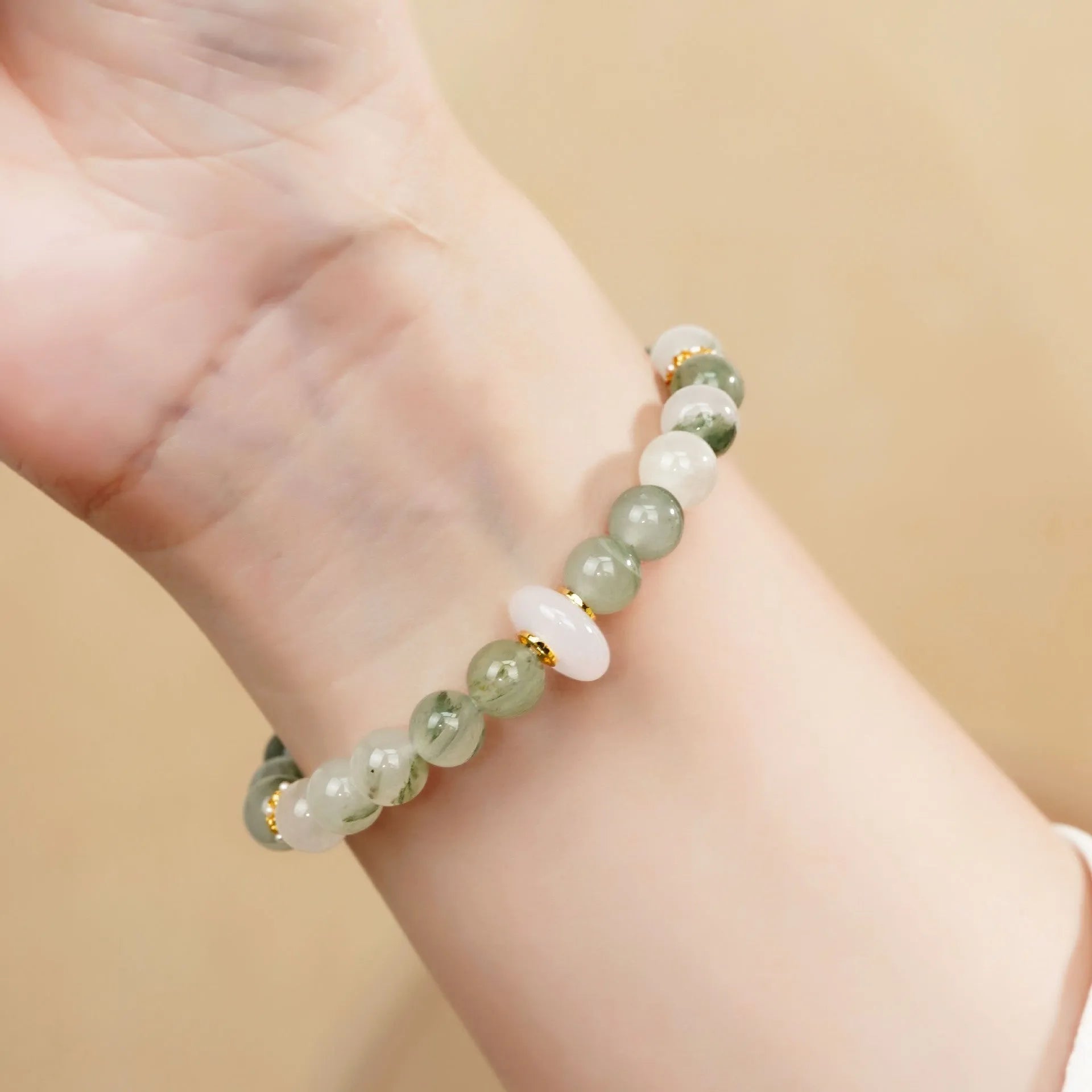 Emerald green Tian Shan Cui jade bracelet with floating flower girl half design and round elements
