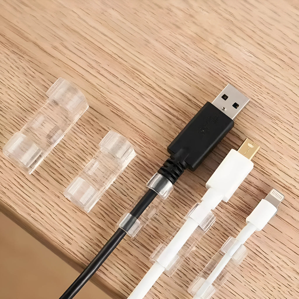 Transparent self-adhesive plastic cable clips in small, medium, large, and extra large sizes for wire management.