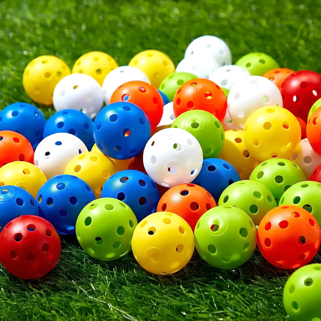 Multi-coloured golf practice balls in net storage pocket for putting training