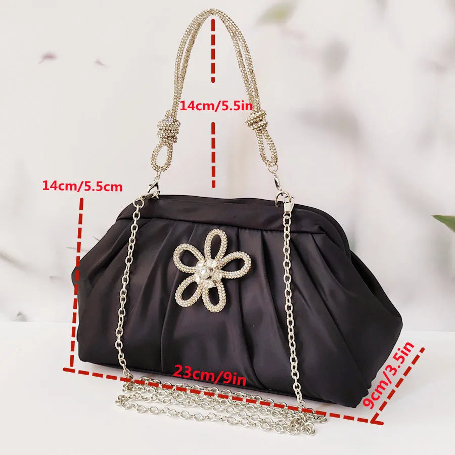 Women's soft polyester shoulder messenger bag in shell shape with diamond folds and chain detail.