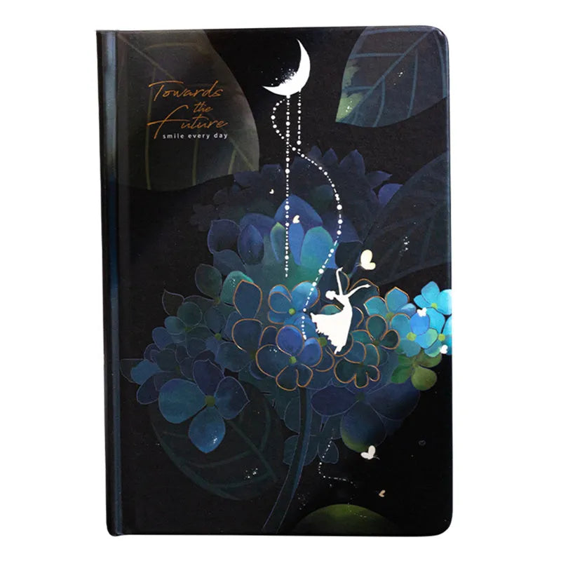 A5 notebook with luminous reflective cover shown in four colours: deep blue, gold, light blue, purple, open to reveal pages with colour illustrations.