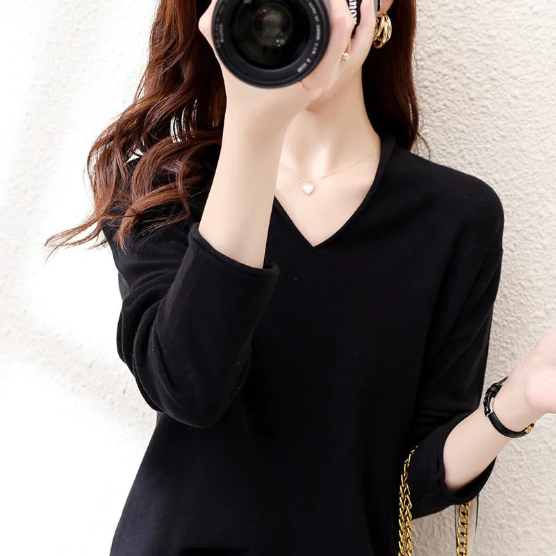 Women's V-neck long sleeve knit pullover top in a macaron colour on a hanger.