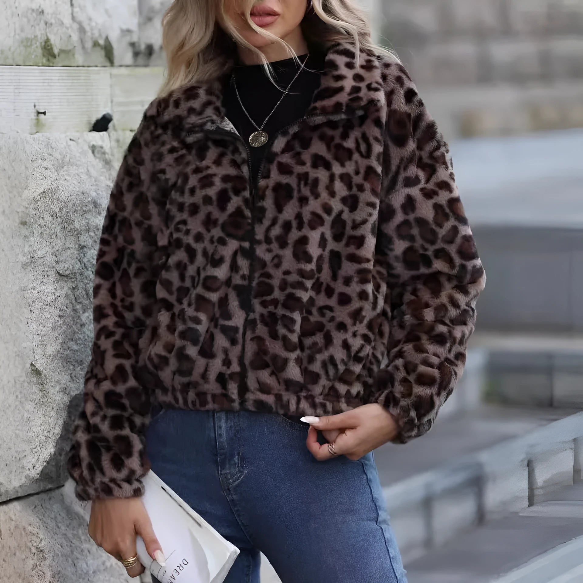 Women's loose leopard print plush coat with front zip and raglan sleeves on a hanger