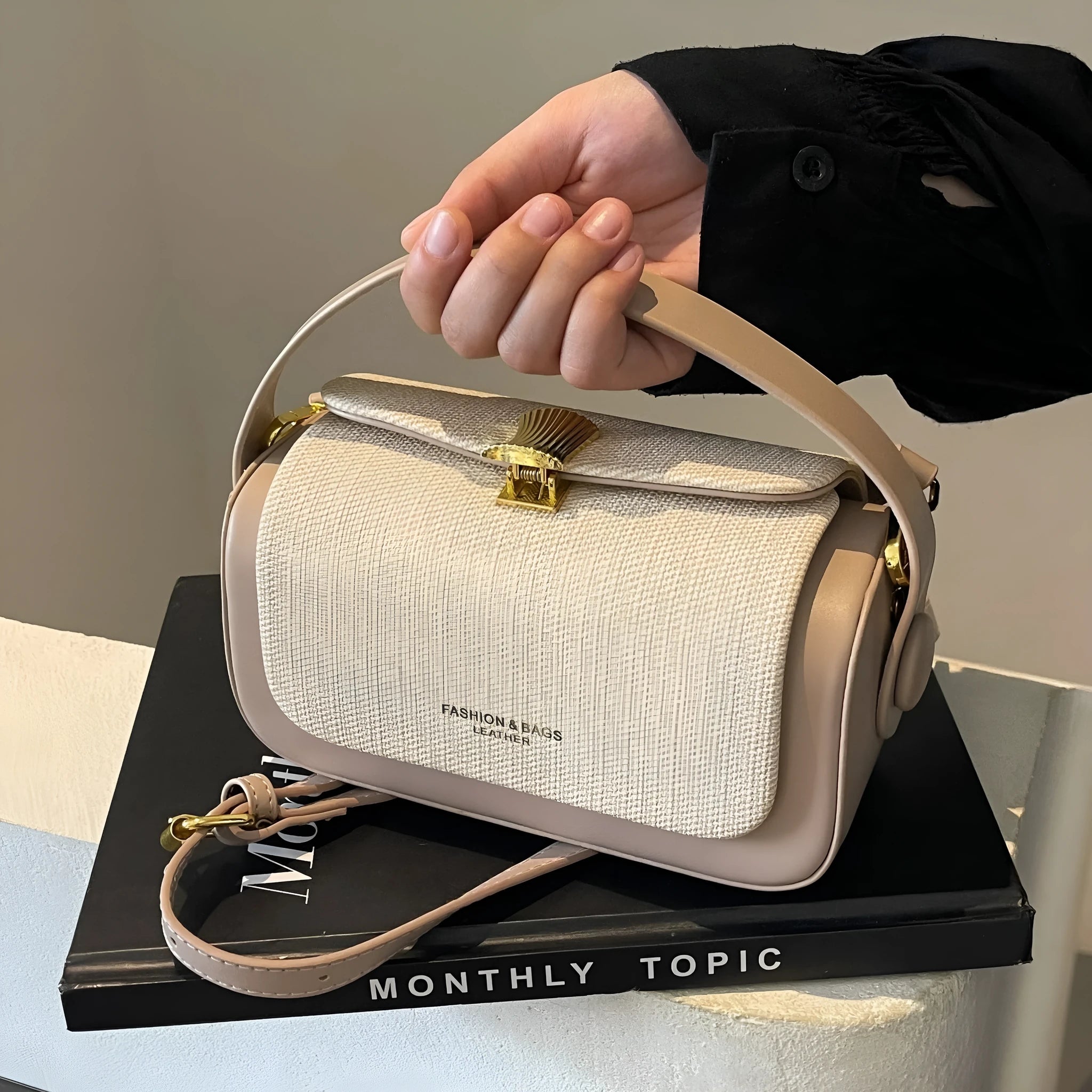 Women's black PU leather messenger bag with horizontal square shape and single shoulder strap