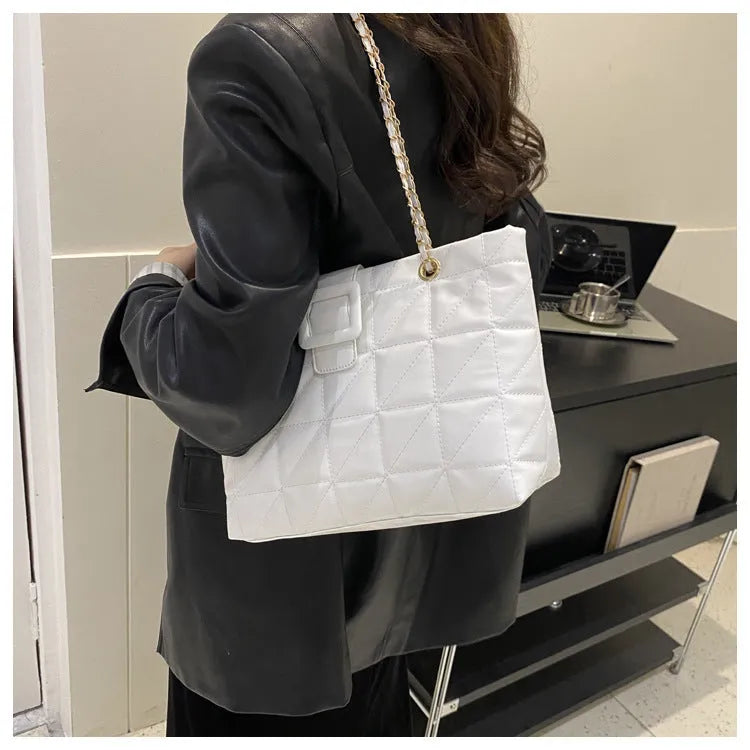 Women shoulder bag in trapezoid shape with chain strap, PU material, three-dimensional pocket, available in black white khaki brown