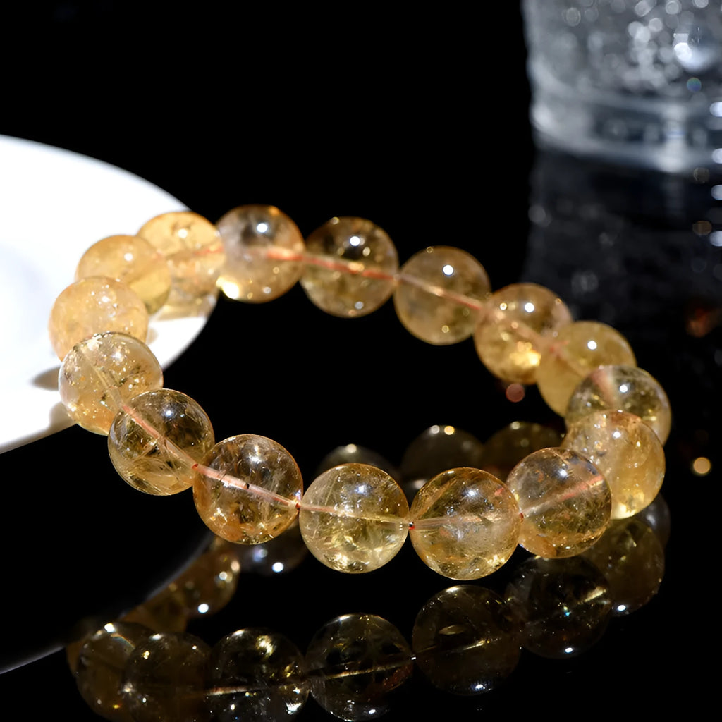 Natural yellow citrine bracelet with geometry-shaped beads in various sizes on display