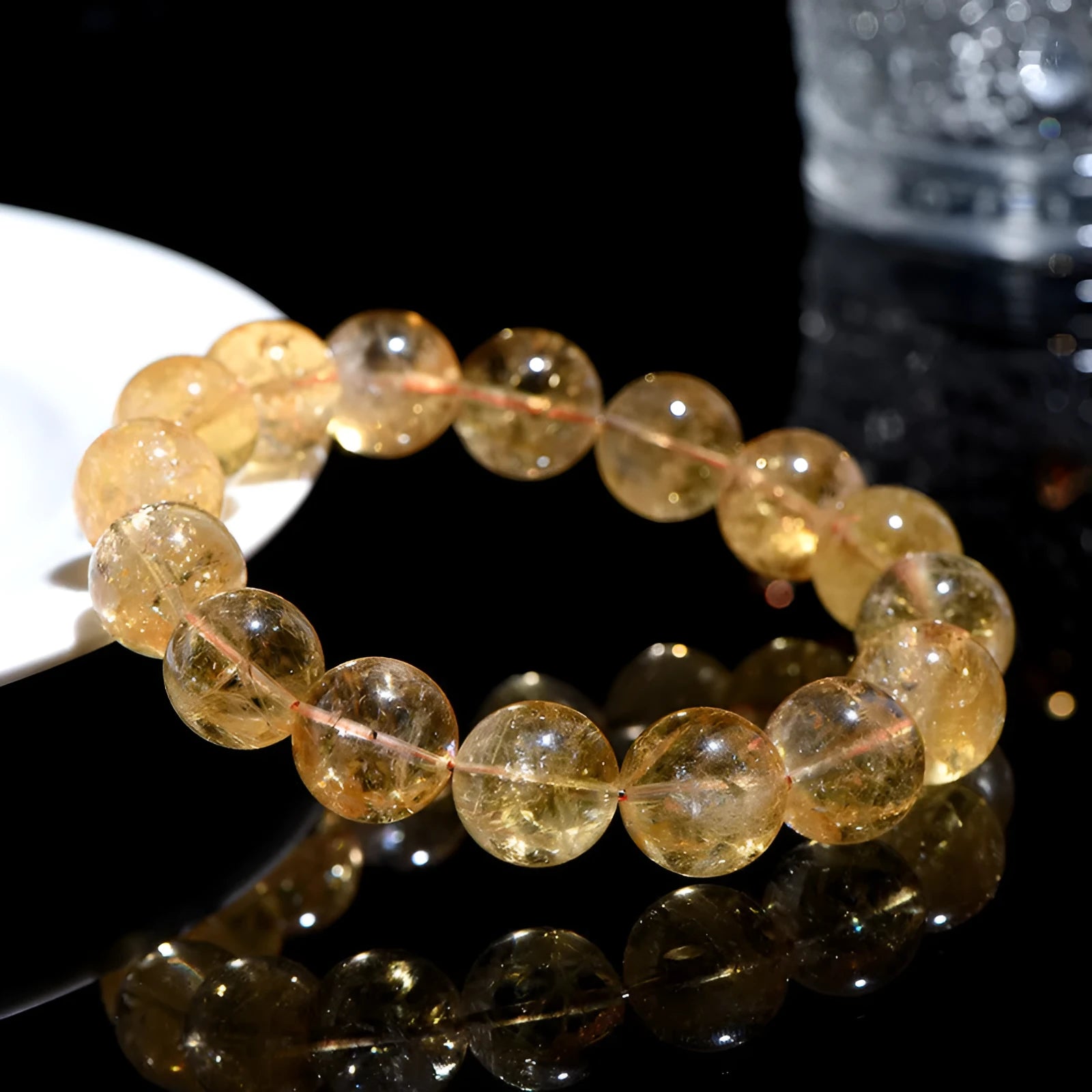 Natural yellow citrine bracelet with geometry-shaped beads in various sizes on display