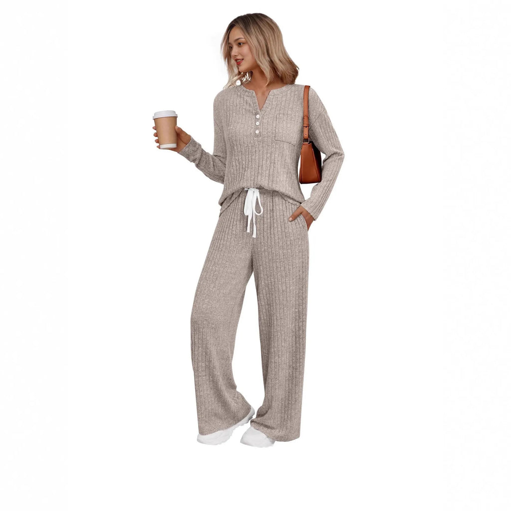 Knitted V-neck striped long coat with long sleeves, pockets, and a lace-up detail on a hanger.