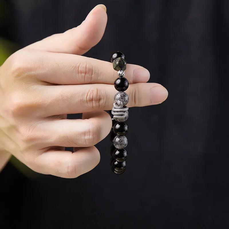 Men's black obsidian crystal and silver snake bracelet with retro zodiac design