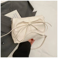 Women's black PU leather crossbody bag with large capacity and a front sandwich pocket.