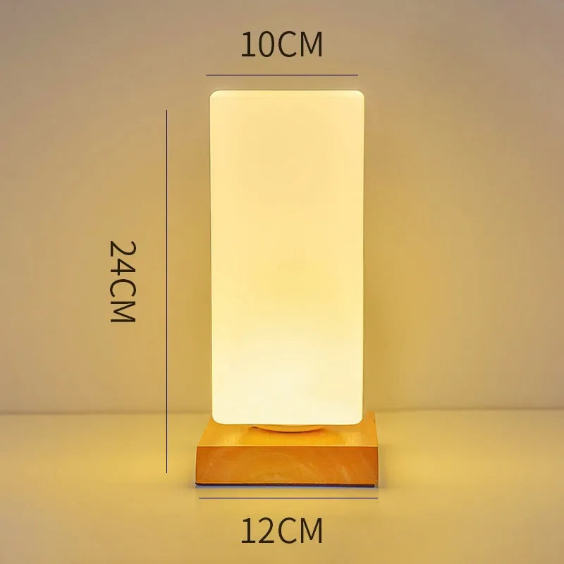 Nordic style solid wood USB table lamp in white, showing touch dimming and one of the geometric shape options.