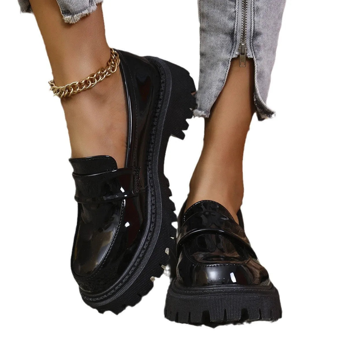 Plus size women's black chunky heel loafers with a slip-on mid-top design and rubber sole.
