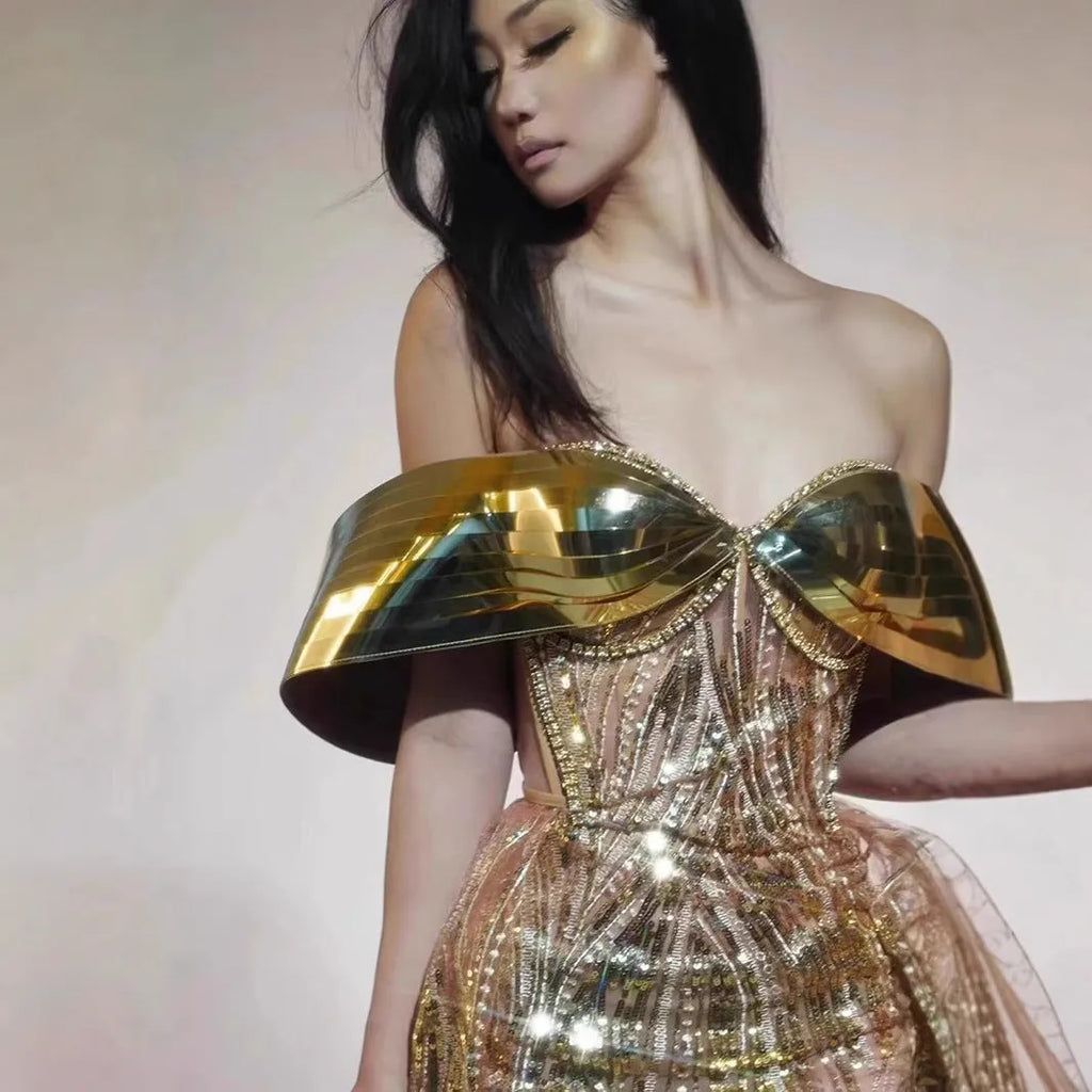 Gold strapless sequined dress with tulle skirt and high-leg split, sleeveless tube top design