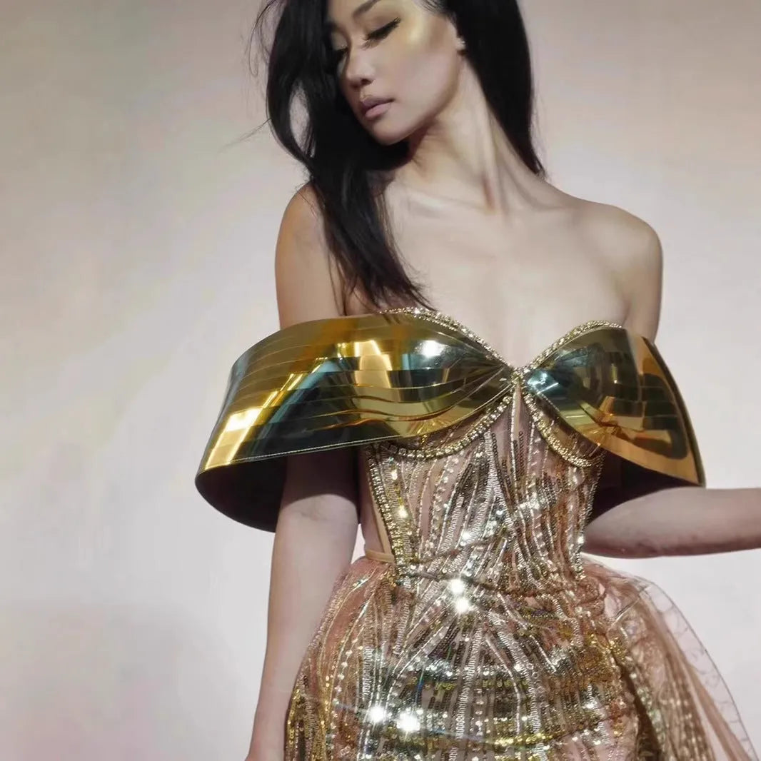 Gold strapless sequined dress with tulle skirt and high-leg split, sleeveless tube top design