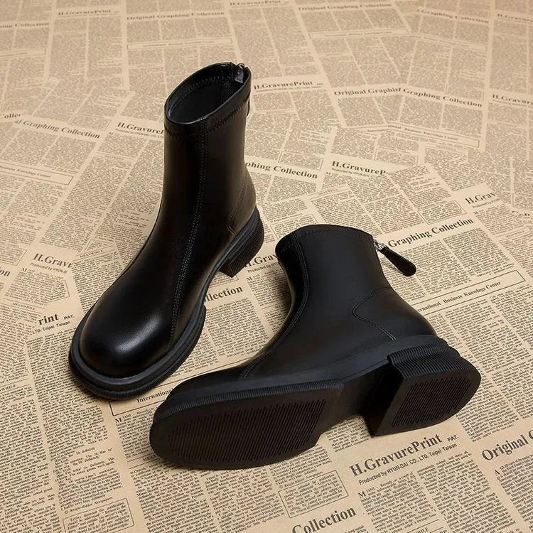 Women's flat heel ankle boots with round toe and back zip closure in black or brown colours
