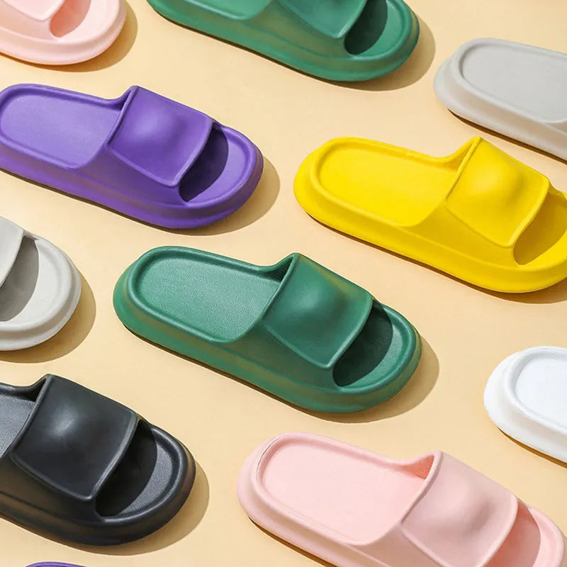 Pair of thick-soled EVA flip-flop slippers in a choice of seven colours on a white background.
