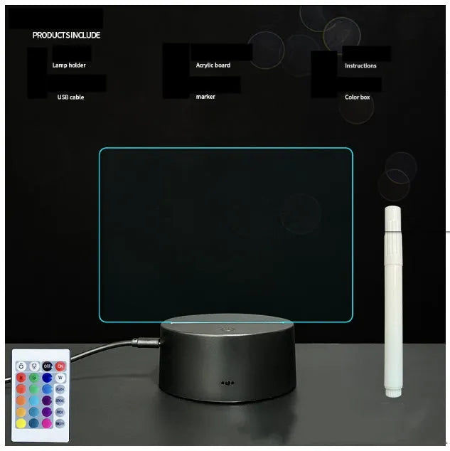 3D acrylic LED message board night light with remote control and marker pen on a desk.